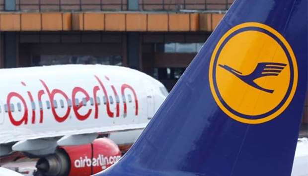 A Lufthansa airliner parks next to an Air Berlin plane at Tegel airport in Berlin on Thursday.