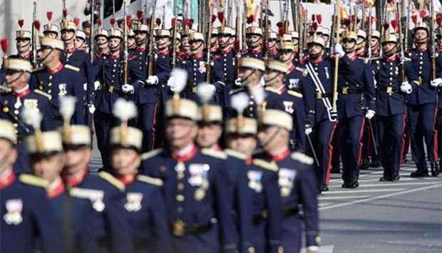 Spanish troops march during the Spanish National Day military parade in Madrid on Thursday.