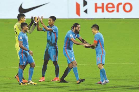 India captain Sunil Chhetri (right) celebrates his teamu2019s 4-1 victory in the 2019 Asian Cup qualifying match against Macau with his teammates at the Kanteerava Stadium in Bengaluru. (AFP)