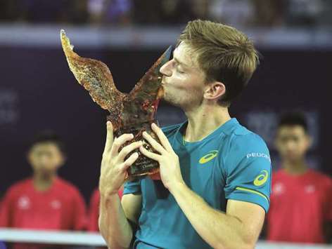 David Goffin poses with the trophy after winning Shenzhen Open yesterday. (AFP)