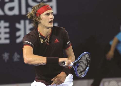 Alexander Zverev of Germany hits a return against Damir Dzumhur of Bosnia and Herzegovina during their singles quarter-final at the ATP Shenzhen Open tennis tournament in Shenzhen on September 29, 2017. (AFP)
