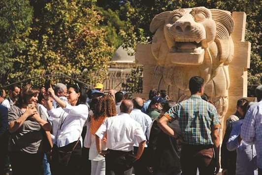 The General Directorate of Antiquities and Museums in Syria present the statue of the Lion of Al-Lat, after its restoration at the National Museum in Damascus yesterday.