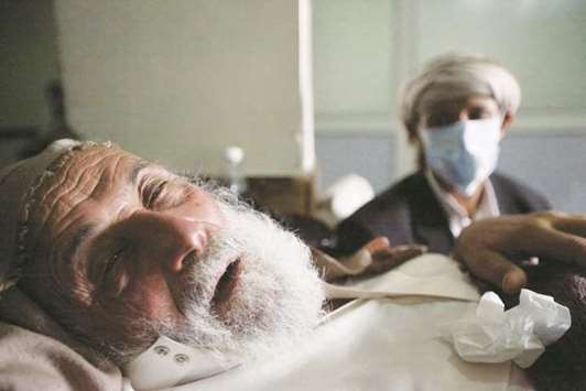 An old man infected with cholera lying on the bed at a hospital in Sanaa, Yemen.