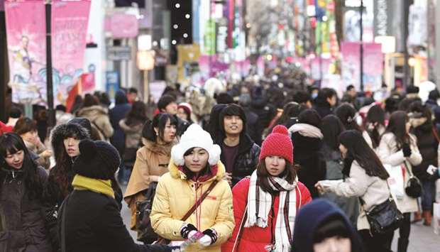 Shoppers walk through the Myeongdong shopping district of Seoul, South Korea. Annual inflation in Asiau2019s fourth-largest economy accelerated to the fastest in more than five years in August, sapping returns from fixed-income payments.