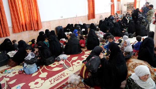 Civilians who escaped from the Islamic State militants at Raqqa's frontline rest at a mosque in Raqq
