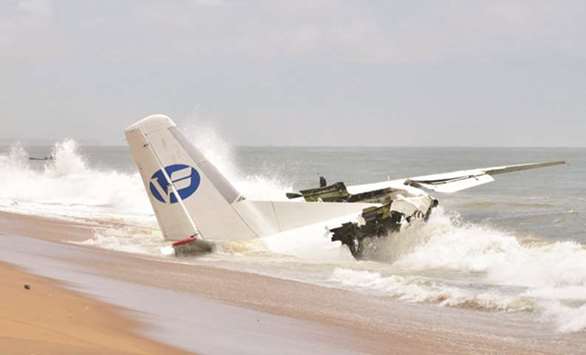 The wreckage of an Antonov cargo plane that crashed off Ivory Coast sits on the beach of Port-Bouet in Abidjan.