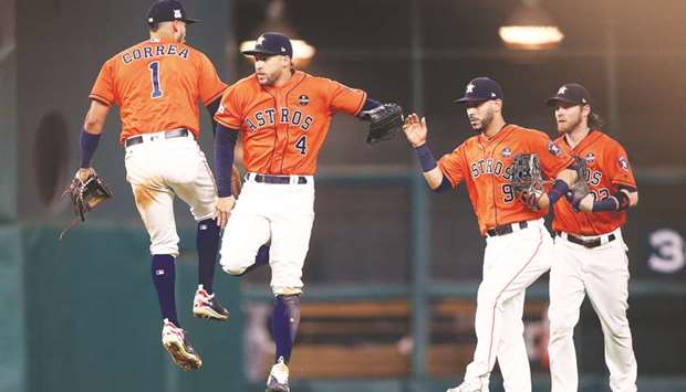 Houston Astros centre fielder George Springer (No 4) and shortstop Carlos Correa (No 1) celebrate after beating the New York Yankees during game one of the 2017 ALCS playoff series at Minute Maid Park. PICTURE: USA TODAY Sports