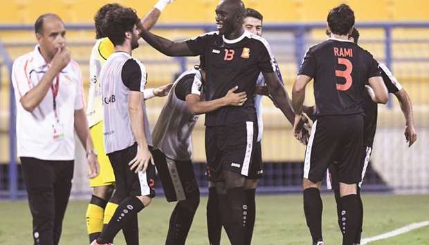 Yannick Sagbo (13) is congratulated by his Umm Salal teammates after he recorded a hat-trick against Al Arbi yesterday.