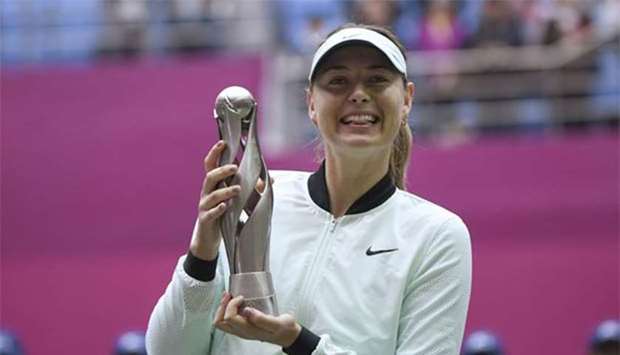 Maria Sharapova holds the trophy after winning the Tianjin Open on Sunday.