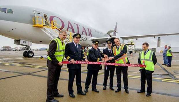 Officials are pictured at the arrival of Qatar Airways Cargou2019s Boeing 777 freighter at Pittsburgh International Airport.