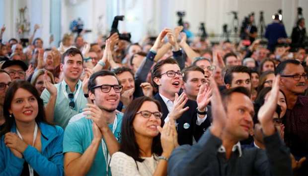 Supporters of the Peoples Party (OeVP) react after first exit polls in Vienna