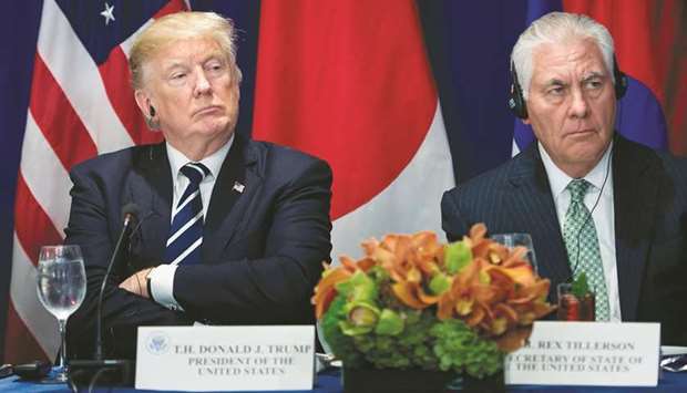 At odds: President Donald Trump with Secretary of State Rex Tillerson.