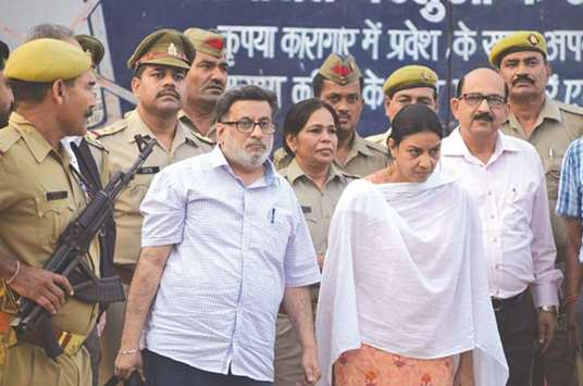 Rajesh and Nupur Talwar walk out of Dasna jail in Ghaziabad after the Allahabad High Court acquit them, yesterday.