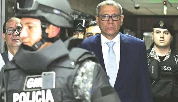 Vice-President Glas is escorted back to the courtroom during his habeas corpus hearing on Saturday at the National Court of Justice in Quito.