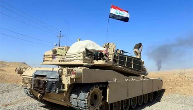 A tank belonging to Iraqi army is seen in the Dibis area on the outskirts of Kirkuk on Tuesday.