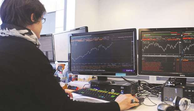A trader is seen at the London Stock Exchange. The FTSE 100 dipped 0.1% to 7,526.97 points yesterday.