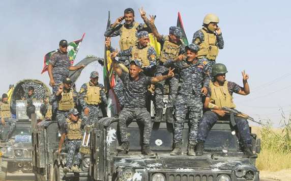 Members of Iraqi federal forces are seen in Dibis area on the outskirts of Kirkuk, yesterday.