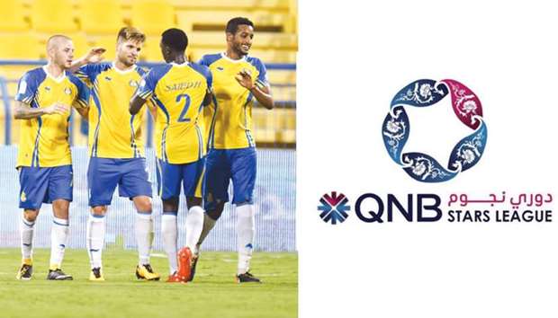 Al Gharafa players celebrate a goal during their QNB Stars League match against Al Khor on Saturday. Gharafau2019s 3-0 victory in the match was their first win of the league this season. PICTURE: Noushad Thekkayil