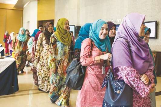 Delegates wait in line for a seminar at the Global Islamic Finance Forum in Kuala Lumpur (file). According to Marzunisham Omar, the assistant governor of Malaysiau2019s central bank, the growth of fintech provides u201cinnovative opportunitiesu201d within the entire financial sector and thus cannot be ignored by the Islamic finance industry, particularly in Malaysia.