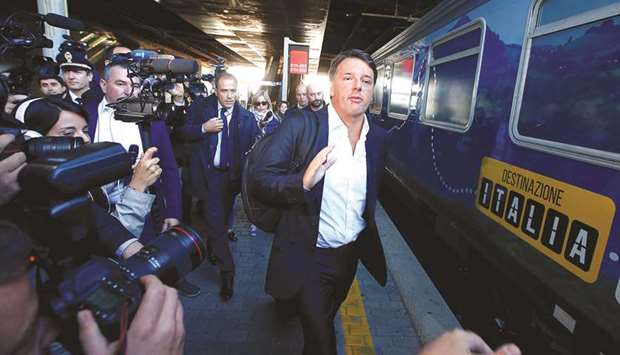 Renzi arrives to board a train during his u2018Destinazione Italiau2019 (Destination Italy) electoral tour at the Tiburtina train station in Rome.