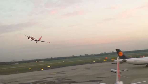 The A330 jet flew low across the runway, then pulled up and banked sharply to the left before landing on its second approach. Picture: Image grab from a video posted on social media