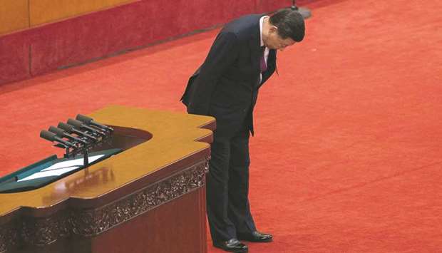 Chinau2019s President Xi Jinping bows to delegates after delivering a speech at the opening session of the Chinese Communist Partyu2019s Congress at the Great Hall of the People in Beijing.