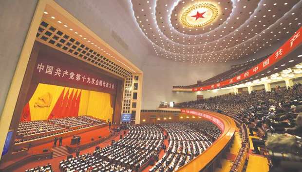 A general view shows delegates attending the opening of the 19th Communist Party Congress at the Great Hall of the People in Beijing yesterday. The Chinese Communist Party opens its week-long, twice-a-decade congress in the Great Hall of the People.