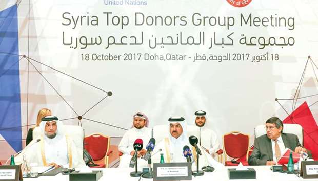 HE Dr Ahmed bin Hassan al-Hammadi and HE Dr Ahmed bin Mohammed al-Muraikhi at the Syria Top Donors Group Meeting in Doha yesterday.