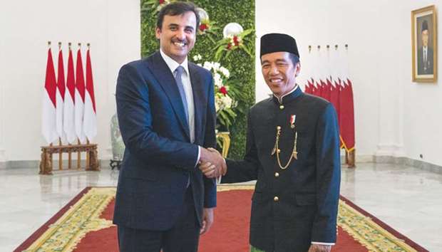 His Highness the Emir Sheikh Tamim bin Hamad al-Thani being received by Indonesian President Joko Widodo at the Bogor presidential palace yesterday.