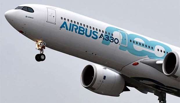 A new Airbus A330neo makes its first flight over Colomiers, after taking off from the Toulouse-Blagnac airport, on Thursday.