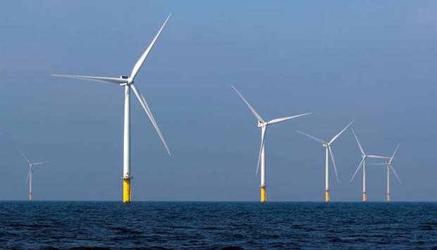 Power-generating windmill turbines are seen at the Eneco Luchterduinen offshore wind farm near Amsterdam