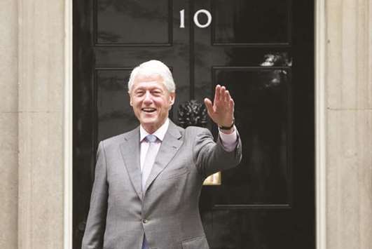 Former US president Bill Clinton leaves 10 Downing Street after meeting with British Prime Minister Theresa May in London yesterday.