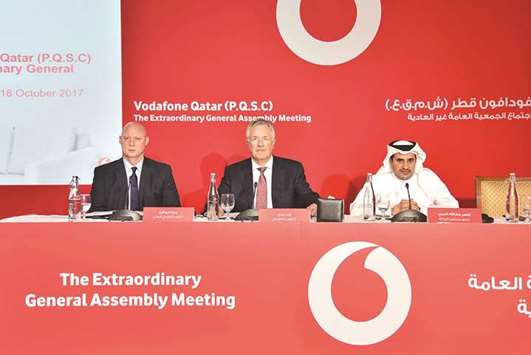 Gray (centre) with Goschen and al-Marri at Vodafone Qataru2019s extraordinary general assembly in Doha on Wednesday.