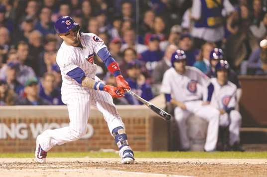 Chicago Cubs second baseman Javier Baez hits a solo home run against the Los Angeles Dodgers in the fifth inning in game four of the 2017 NLCS playoff series at Wrigley Field. PICTURE: USA TODAY Sports