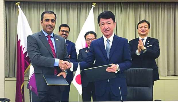 Essa bin Hilal al-Kuwari and Akihiko Miyamoto after signing the MoU in the presence of HE Dr Mohamed bin Saleh al-Sada and other dignitaries in Tokyo 