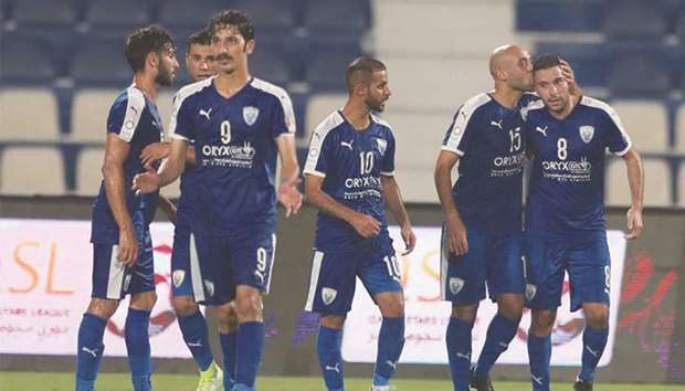 Al Kharaitiyat players celebrate one of their goals against Al Gharafa yesterday.