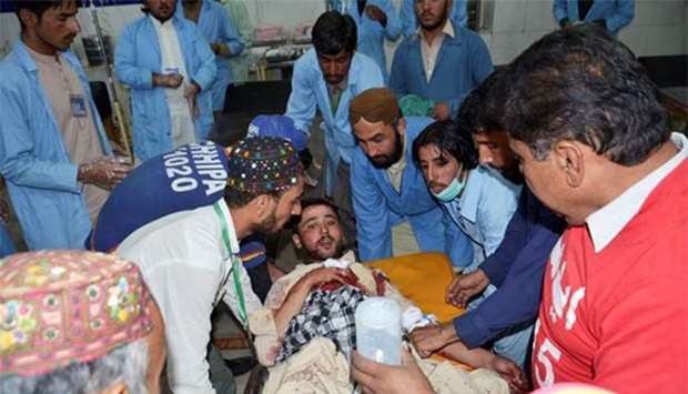 Hospital staff transfer a man injured in a blast in Mastung at a hospital in Quetta on Thursday.