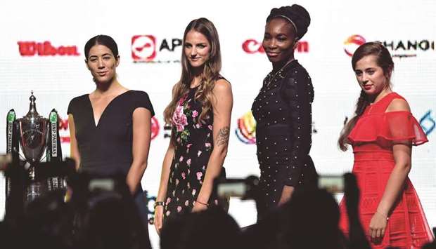 (From left) Garbine Muguruza of Spain, Karolina Pliskova of Czech Republic, Venus Williams of the US and Jelena Ostapenko of Latvia pose for photographers during the Official Draw Ceremony of the WTA Finals Singapore yesterday. (AFP)
