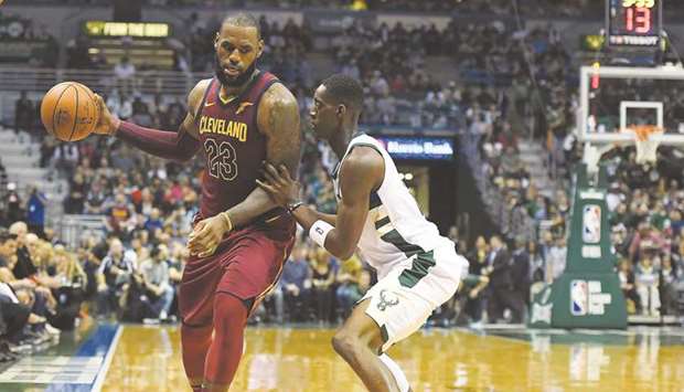 LeBron James of the Cleveland Cavaliers in action against Tony Snell of the Milwaukee Bucks during the second half of their NBA game at the Bradley Centre in Milwaukee, Wisconsin. (Getty Images/AFP)