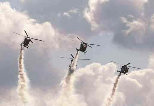 The Indian Air Forceu2019s Sarang helicopter display team flies HAL Dhruv aircraft during an event to mark the 85th anniversary of the IAF at Bamhrauli Air Force Station in Allahabad yesterday.