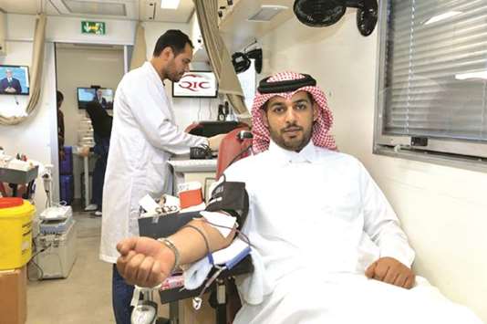 Salem al-Mannai, deputy group president and CEO, QIC Mena, donating blood.