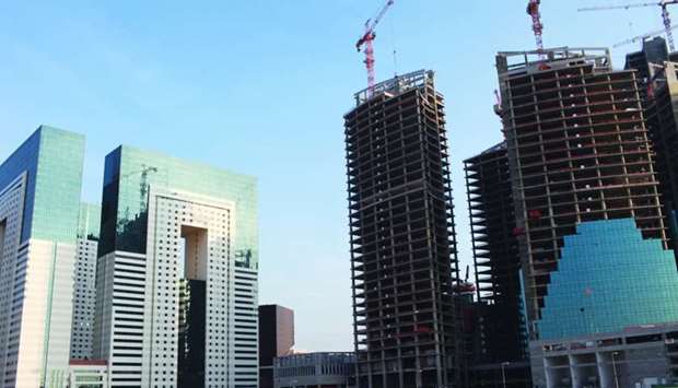 New buildings under construction in Doha (file). The total domestic credit by commercial banks in Qatar's realty sector grew more than 14% to QR805.17bn in August this year, according to the latest figures released by the Qatar Central Bank.