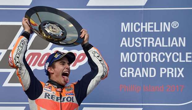 Honda rider Marc Marquez of Spain celebrates his victory on the podium at the end of the Australian 
