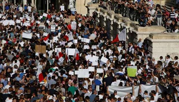 People protest against the assassination of investigative journalist Daphne Caruana Galizia in Valletta on Sunday.