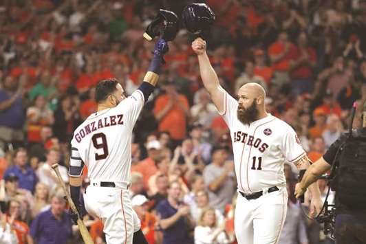 Houston Astros catcher Evan Gattis (right) celebrates with Houston Astros left fielder Marwin Gonzalez after hitting a home run in the fourth inning during game seven of the 2017 ALCS playoff baseball series against the New York Yankees. PICTURE: USA TODAY Sports