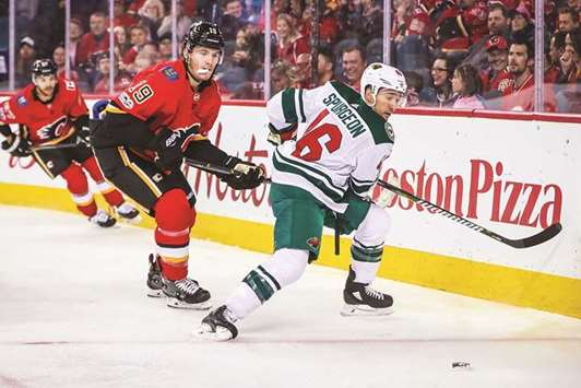 Minnesota Wild defenseman Jared Spurgeon (right) and Calgary Flames left wing Matthew Tkachuk battle for the puck during the first period at Scotiabank Saddledome. PICTURE: USA TODAY Sports
