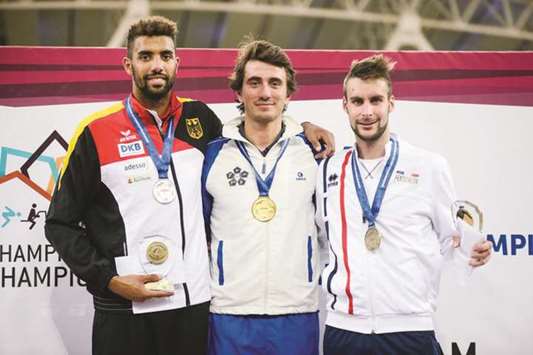 Riccardo de Luca (centre) of Italy poses after winning the Modern Pentathlon Champion of Champions menu2019s title, with silver medallist Patrick Dogue (left) of Germany and third-placed Valentin Belaud of France at the Al Shaqab arena yesterday.