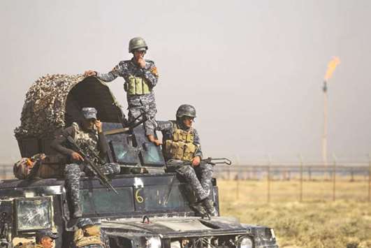 Iraqi forces drive past an oil production plant after they seized an oil field in Kirkuk province during an operation against Kurdish fighters as they head towards the city of Kirkuk on October 16. Oil exports from Iraqu2019s Kurdistan via the Turkish Mediterranean port of Ceyhan were still flowing at sharply reduced rates on Saturday and yesterday, two shipping sources told Reuters. Flows were fluctuating at between 200,000 bpd and 250,000 bpd versus normal flows of around 600,000 bpd. Exports have dropped since Wednesday last week when Iraqi military forces took over the Kirkuk area from the Kurdish Peshmerga forces, resulting in a sharp drop in output from nearby fields. Iraqi oil ministry officials have said they were hoping to bring output back to normal by Sunday but it has not happened yet, one of the sources said.