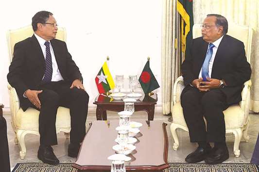 Kyaw Tint Swe, left, Myanmaru2019s Union Minister for the Office of the Ministry of the State Counsellor, and Bangladesh Foreign Minister A H Mahmood Ali speak prior to a meeting in Dhaka yesterday.