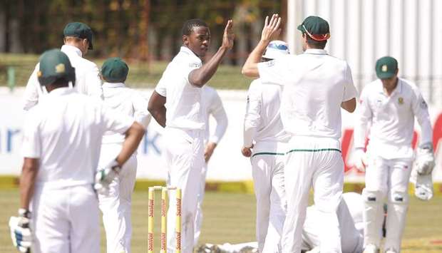 South Africau2019s Kagiso Rabada (centre) celebrates the wicket of Bangladeshu2019s Mushfiqur Rahim (not in picture) on Day Five of the first Test in Potchefstroom, South Africa, yesterday. (AFP)